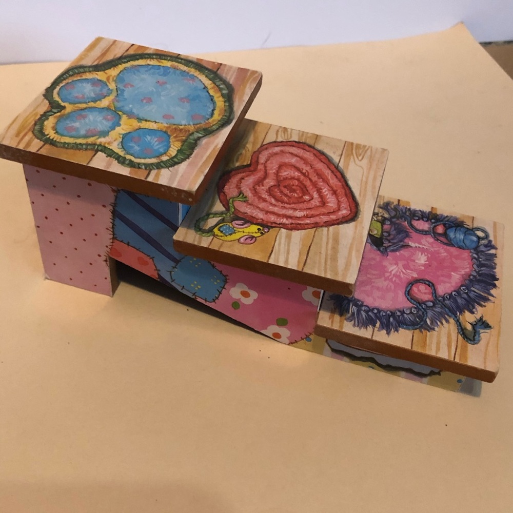 Calico kittens 3 stair figure shelf. With rug look